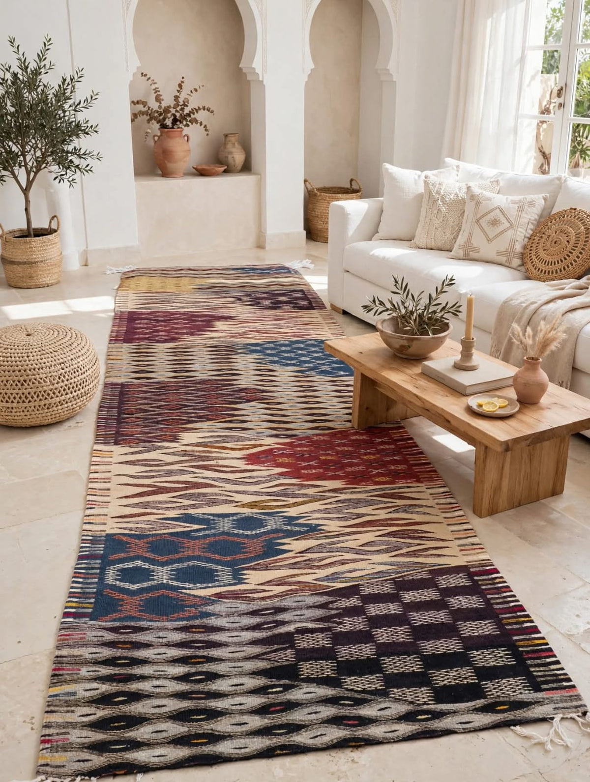 A long rectangular area rug with a multicolor geometric and tribal pattern, handmade Moroccan Berber rug from Taznakht, bohemian living room